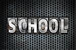 The word "School" written in vintage metal letterpress type on a black industrial grid background.