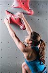 Picture of Young female climbing on wall