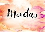 The word "Monday" written in black paint on a colorful watercolor washed background.