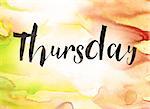 The word "Thursday" written in black paint on a colorful watercolor washed background.