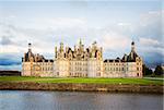 facade of Chambord chateau at sunset, Pays-de-la-Loire, France, retro toned