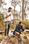 Men drinking coffee in forest, Deer Park, Cape Town, South Africa