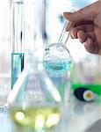 Scientist preparing a chemical formula in a conical flask during an experiment in the laboratory