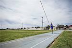 Young male pole vaulter sprinting with pole vault at sport facility