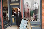 Businesswoman in front of vintage shop