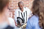 Street musician bowing to crowd