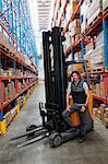 Warehouse worker with forklift