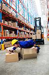 Worker lying on boxes