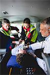 Injured man with ambulance men