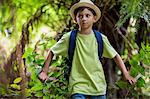 Boy walking in forest