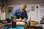 Concentrated cobbler making shoes