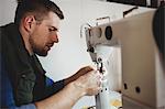 Profile view of cobbler using a sewing machine