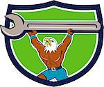 Illustration of a american bald eagle mechanic lifting giant spanner looking up to the side set inside shield crest on isolated background done in cartoon style.