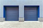 Metal blue gates of the shop storage.