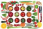Health and super food selection for paleo diet with fruit and vegetables over white background. High in vitamins, antioxidants, minerals and anthocyanins.