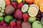Juicy health fruit selection forming a background. High in antioxidants, vitamins, anthocyanins and dietary fiber.