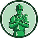 Illustration of a green plastic toy builder construction worker standing wearing hard hat holding hammer arms crossed viewed from front set inside circle on isolated background done in retro style.
