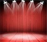Illuminated empty red concert stage with soffits
