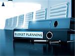 Budget Planning. Concept on Blurred Background. Budget Planning - Business Concept on Toned Background. Office Folder with Inscription Budget Planning on Wooden Table. 3D.