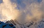 Snowy mountaintops and clouds