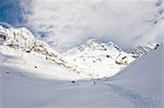 Hiker in snowy mountain landscape