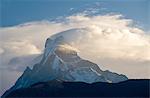 Snowy mountaintop and clouds