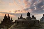 Silhouetted buddha, The Buddhist Temple of Borobudur, Java, Indonesia