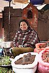 Portrait of female street trader with herbs and spices, Thamel, Kathmandu, Nepal