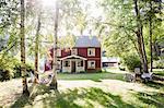 Sweden, Narke, Finnerodja, View man reading in hammock