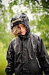 Sweden, Uppland, Blond girl (8-9) in raincoat