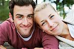 Sweden, Vastra Gotaland, Kallandso, Portrait of young couple relaxing in park