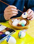 Man decorating Easter eggs