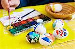 Man decorating Easter eggs