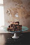 Chocolate cake with nuts on table