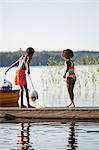 Sweden, Vastra Gotaland, Skagern, Girl (6-7) and boy (10-11) fishing in lake