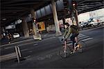 Sweden, Sodermanland, Stockholm, Sodermalm, Slussen, Mid adult man cycling in city