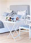 Sweden, Breakfast table in bedroom with blue and white themes