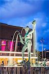 Sweden, Gothenburg, Gotaplatsen with statue of Poseidon in fountain at dusk