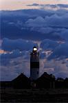 Sweden, Oland, Ottenby, Illuminated lighthouse against dramatic sky