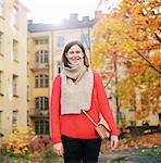 Finland, Helsinki, Kallio, Portrait of woman in red sweater