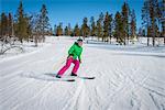 Finland, Lapland, Levi, Portrait of mid-adult woman skiing