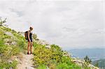 France, Pelleautier, Ceuse, Woman standing on hiking path on mountain side