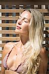 Close-up of young  woman sunbathing