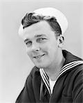 1940s SMILING PORTRAIT AMERICAN SAILOR WEARING NAVY UNIFORM LOOKING AT CAMERA