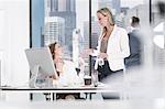 Businesswomen chatting in office