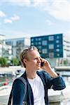 Sweden, Sodermanland, Stockholm, Hammarby Sjostad, Man talking on phone