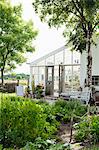 Sweden, Gotland, Bursvik, Burgegard, View of glass patio next to house