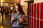 Sweden, Stockholm, Ostermalm, Female student texting on mobile phone