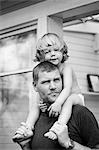 Sweden, Sodermanland, Strangnas, Father carrying daughter (2-3) on shoulders