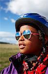 Sweden, Vastra Gotaland, Gullspang, Runnas, Portrait of girl (6-7) in cycling helmet and sunglasses